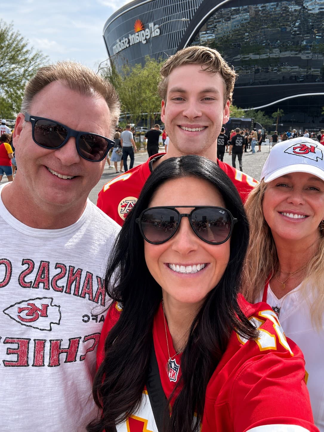 Kristen with her husband Mike, their daughter, and their son at a Chiefs game
