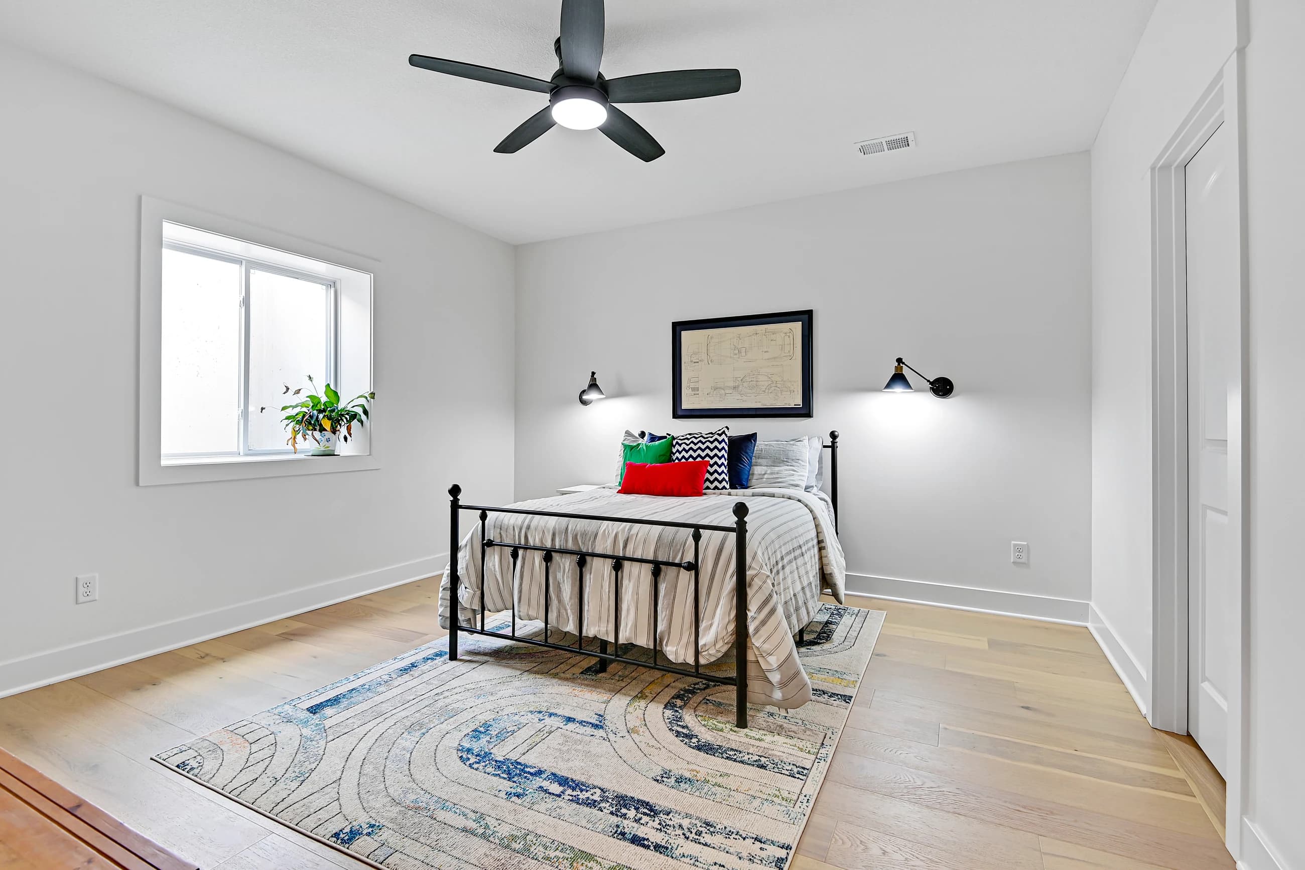Calm, uncluttered guest bedroom prepared for listing photos and buyer showings