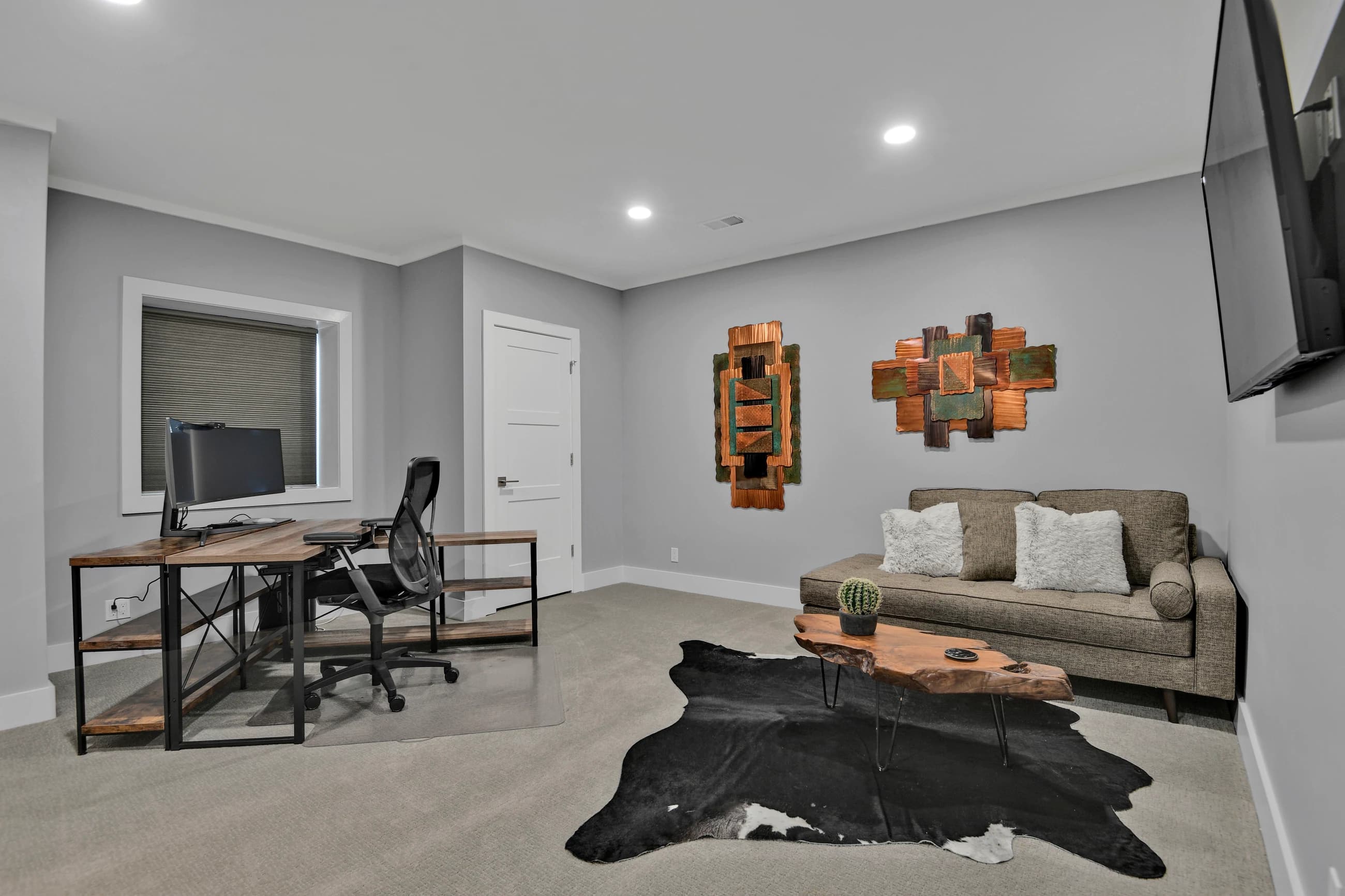 Thoughtfully arranged home office and lounge showing clear furniture placement and buyer-ready styling