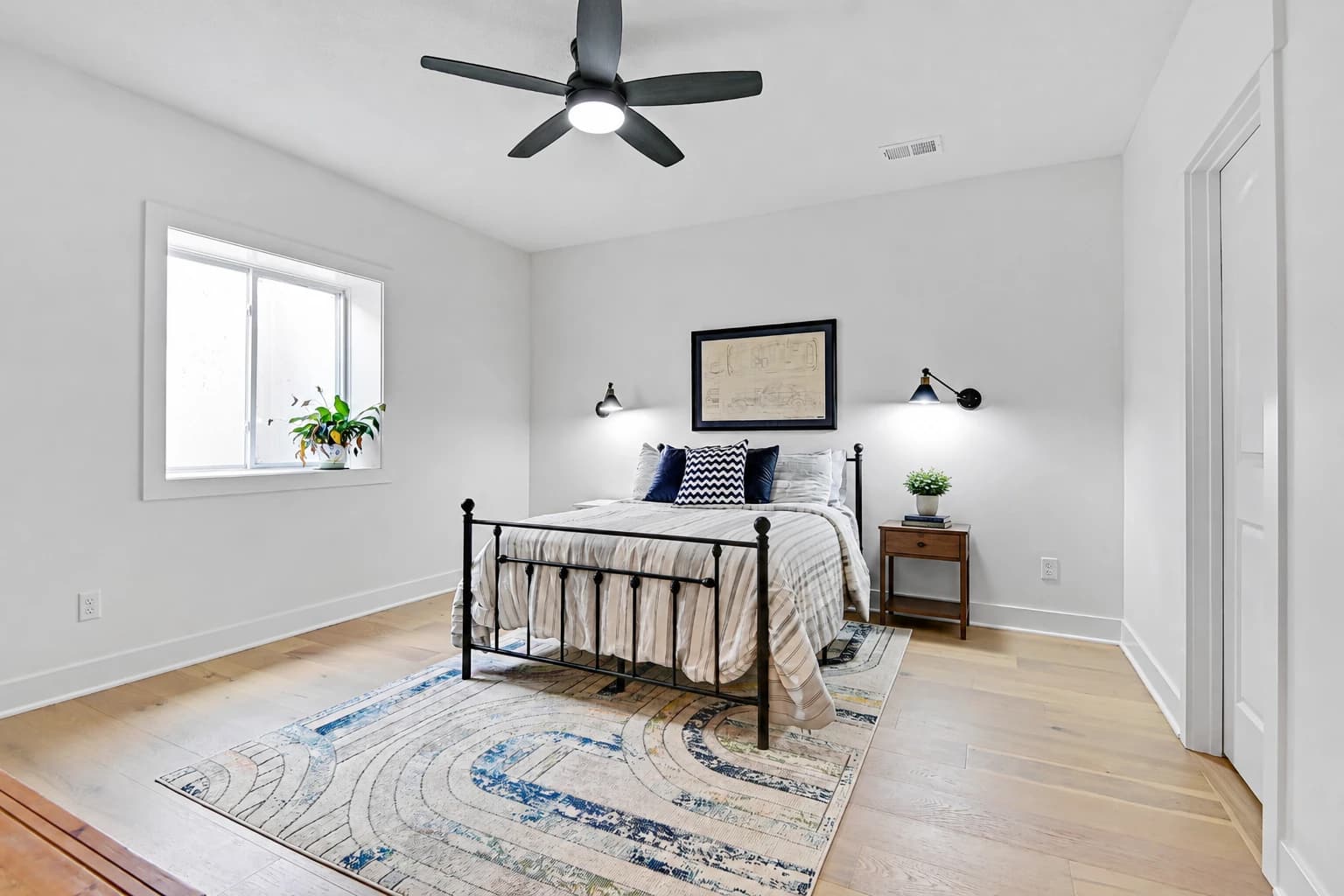 Calm, uncluttered guest bedroom prepared for listing photos and buyer showings